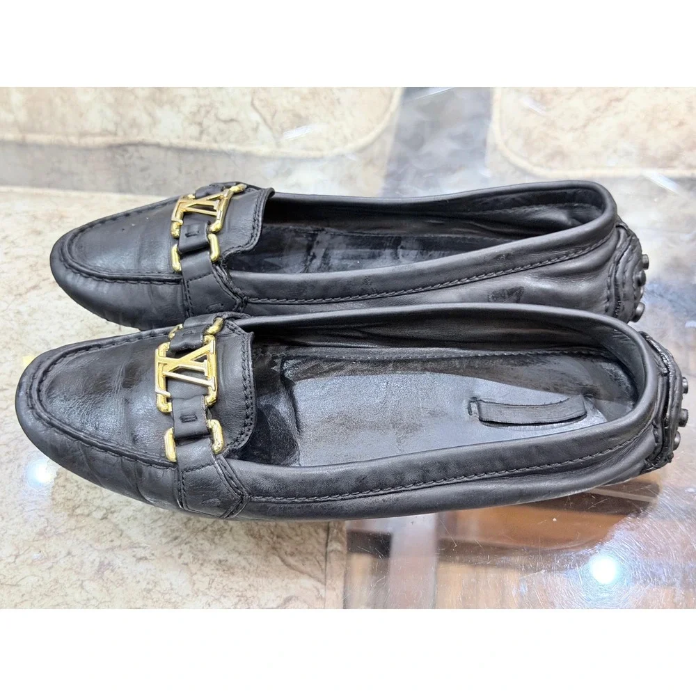 Louis Vuitton Black Leather Loafers Gold LV Logo Driving Shoes Womens Italy 39